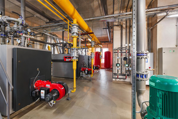 interior of industrial, gas boiler room with boilers; pumps; sensors and a variety of pipelines