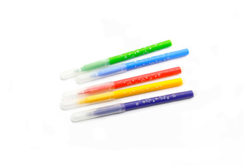 Multicolored felt pens on white background