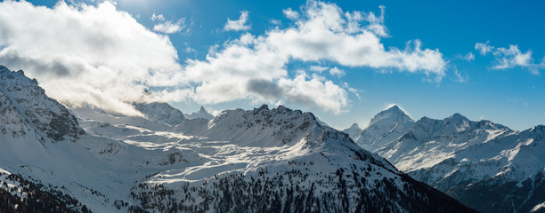 Obraz premium wide angle panoramic view of swiss alps during winter time.