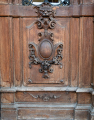old wooden front door with lion ornament