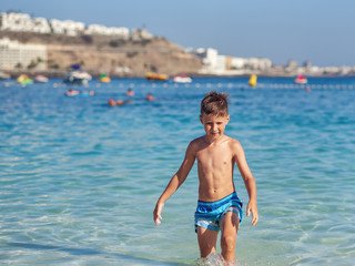 Caucasian boy against the sea.