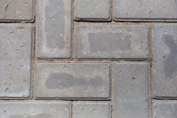 Concrete gray block road closeup background 