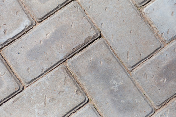 Concrete gray block road closeup background 