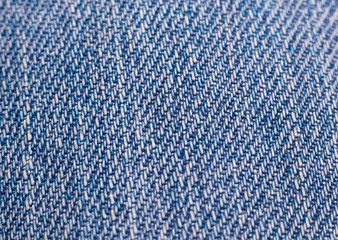 Blue denim textured textile close up 