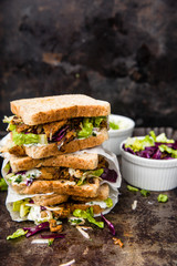 delicious gyros sandwich in paper bag with salad
