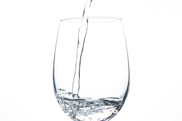 A glass of water on a white background. Close-up