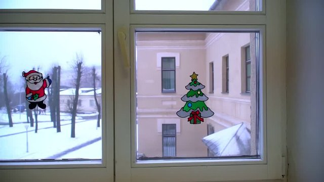 The camera moves toward the window in the hospital. Christmas attribute modeling on the window