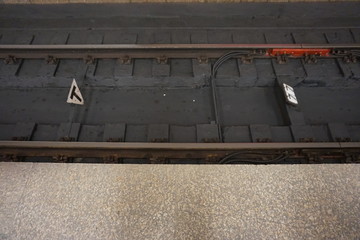 rails, sleepers and part of the platform at the station in the metro