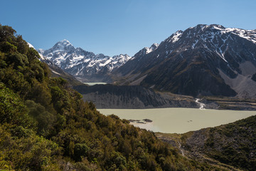 Obraz premium View up the Hooker valley to Mount Cook, Mueller Lake in the foreground and Hooker Lake in the background in front of the Hooker Glacier and Mount Cook. Aoraki/Mount Cook National Park, New Zealand.