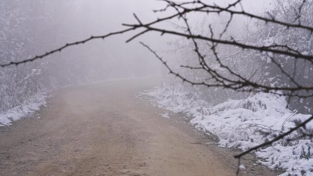 Mountaineers go way through fog - (4K)