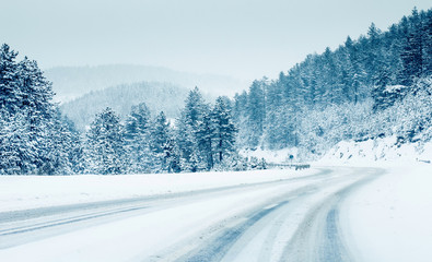 Mountain road landscape covered in snow in winter  - 241788713