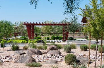 City park with vegetation and wooden Ramada