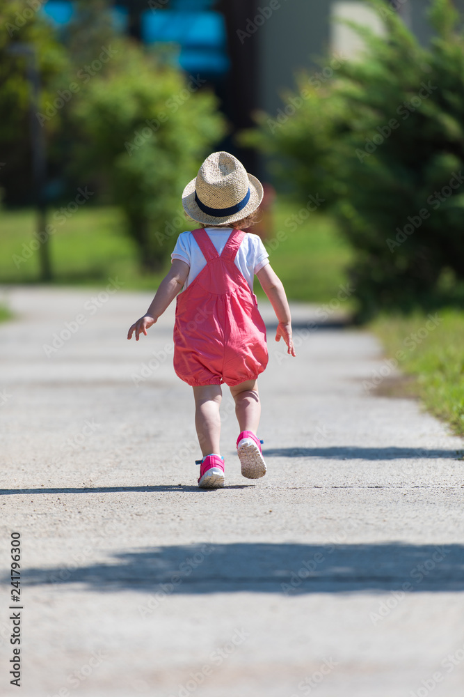 Sticker little girl runing in the summer Park