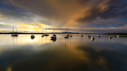 Fototapeta na wymiar boats in the lake on sunset