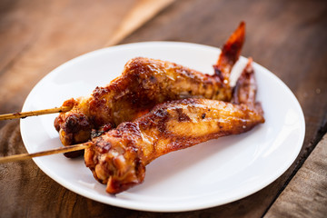 Grilled chicken wing with bamboo stick, Thai style