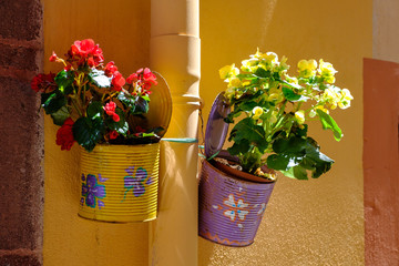 Traditional flower cans in Village of Bosa, Sardinia, Italy.