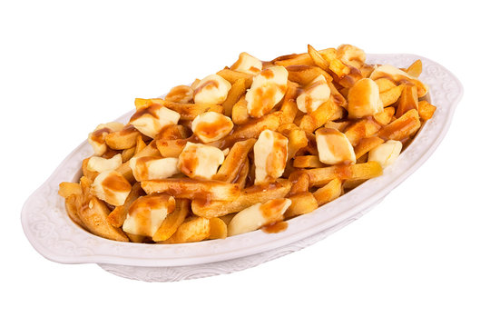 Poutine plate isolated on white background. Meal cooked with french fries, beef gravy and curd cheese. Canadian cuisine.
