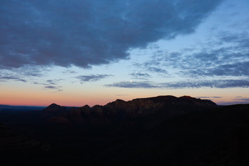 Sunrise Over Desert Mountains with Clouds in the Sky