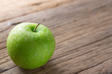 Fresh Green Apple on Wood