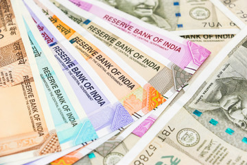 Close up view of brand new indian 10, 50, 100, 200, 500 and 2000 rupees banknotes.