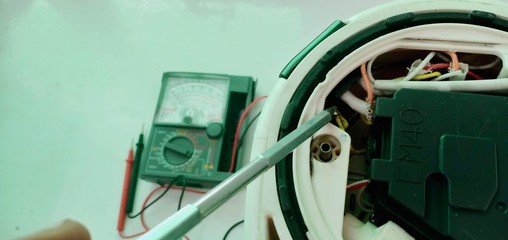 Check and repair the electric boiler with a meter by a technician.