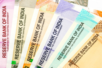 Close up view of brand new indian 10, 50, 100, 200, 500 and 2000 rupees banknotes. Colorful money background.