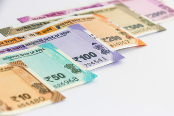 Close up view of brand new indian 10, 50, 100, 200, 500 and 2000 rupees banknotes. Colorful money background.