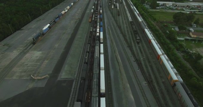 Aerial Flying Forward Over Trains in New Orleans Gentilly Rail Yard