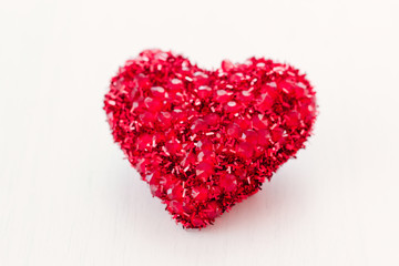 Obraz na płótnie Canvas Vintage handmaded valentines day toy heart. Red heart on a white background. Love symbol concept. 