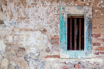 Fototapeta na wymiar Antique old wooden window colonial style on white cement and brick wall