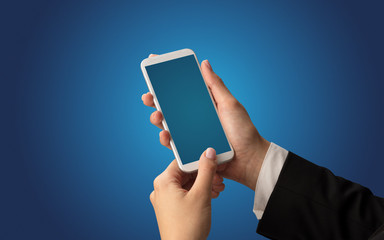 Mockup for female hand using frameless smartphone with dark background
