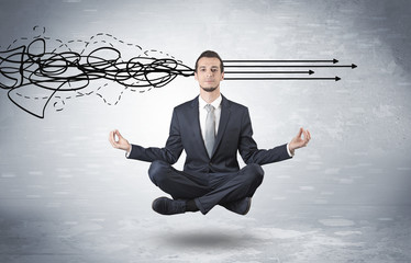 Businessman levitates in yoga position and systematize with thinking concept
