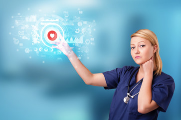 Doctor touching hologram screen displaying medical symbols and charts
