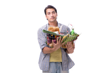 Young man with his grocery shopping on white