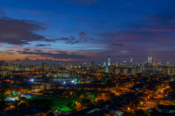 Night view of downtown Kuala Lumpur, a capital of Malaysia. Its modern skyline is dominated by the 451m-tall Petronas Twin Towers.	