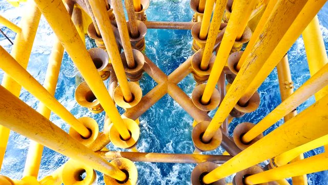 High Waves Hit Oil and Gas Producing Slots and Platform Legs at Offshore Platform - Oil and Gas Industry