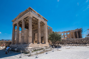 The Erechtheion, north porch, at the Acropolis, Athens, Greece. The Parthenon behind.