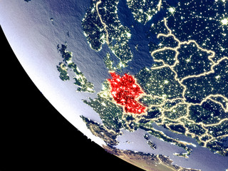 Orbit view of Germany at night with bright city lights. Very detailed plastic planet surface.