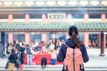 Young woman traveling bacpacker, Asian traveler visit the Che Kung Temple, landmark and popular for...