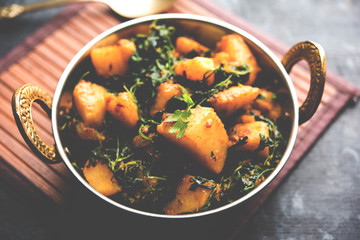 Fenugreek potato sabzi or Aloo Methi masala is healthy Indian Cuisine. served in a bowl or karahi. selective focus