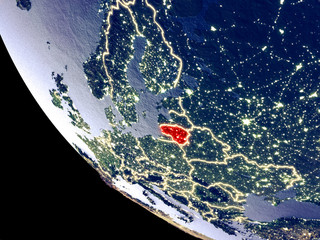 Orbit view of Lithuania at night with bright city lights. Very detailed plastic planet surface.