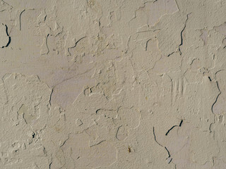 texture of old concrete wall with cracked paint close-up