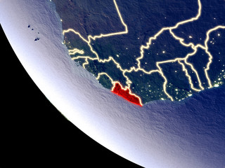 Orbit view of Liberia at night with bright city lights. Very detailed plastic planet surface.