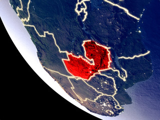 Orbit view of Zambia at night with bright city lights. Very detailed plastic planet surface.