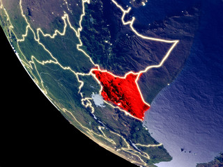 Orbit view of Kenya at night with bright city lights. Very detailed plastic planet surface.