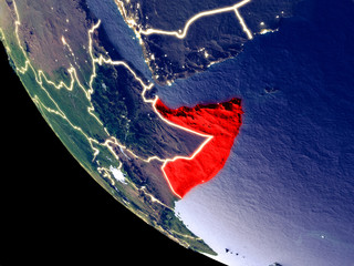 Orbit view of Somalia at night with bright city lights. Very detailed plastic planet surface.