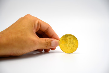 Fototapeta premium Hand holding a bitcoin