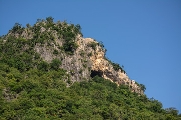 Fototapeta na wymiar High mountains, beautiful blue skies, green trees created by nature in Thailand