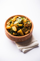 Fenugreek potato sabzi or Aloo Methi masala is healthy Indian Cuisine. served in a bowl or karahi. selective focus