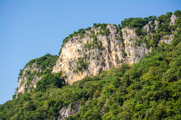 Fototapeta na wymiar High mountains, beautiful blue skies, green trees created by nature in Thailand